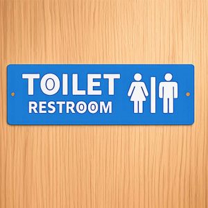 12 × 4 inches toilet / restroom sign with 2 mm raised white acrylic letters and icons on a solid 2 mm blue base.