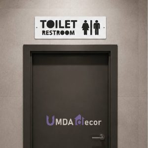 12 × 4 inches reverse-cut toilet / restroom sign: crisp white front panel 2 mm laser-cut to reveal 2 mm black layer beneath. 4 mm total thickness, ready to mount.