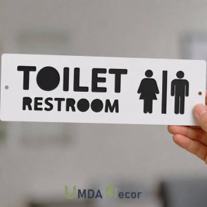 12 × 4 inches reverse-cut toilet / restroom sign: crisp white front panel 2 mm laser-cut to reveal 2 mm black layer beneath. 4 mm total thickness, ready to mount.