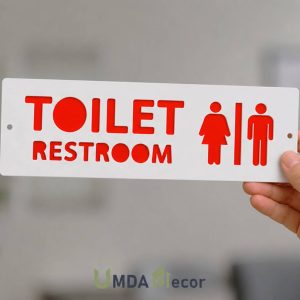 12 × 4 inches reverse-cut toilet / restroom sign: crisp white front panel 2 mm laser-cut to reveal 2 mm red layer beneath. 4 mm total thickness, ready to mount.